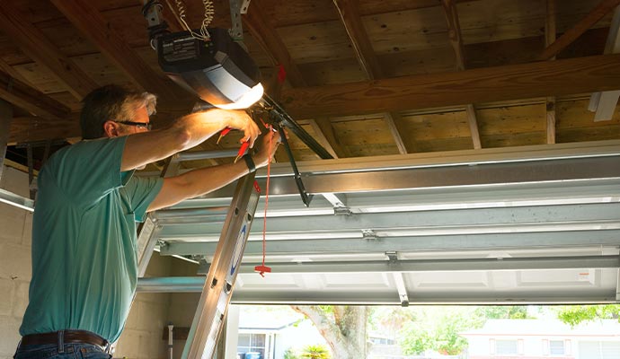 A professional repairing garage door opener