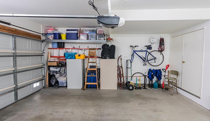 A clean garage space with hanging storage
