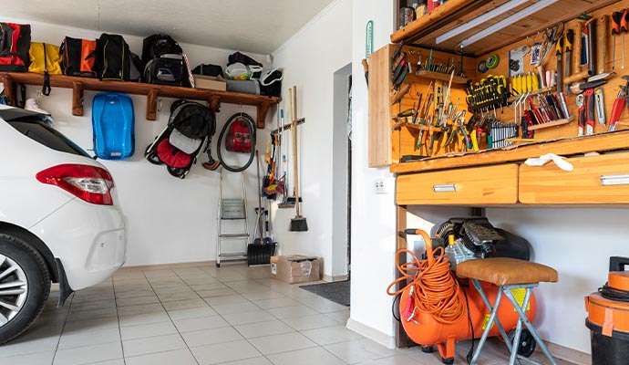 An organized garage with advanced hanging storage features