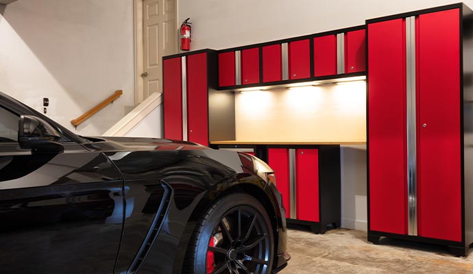 A garage with colorful custom cabinet